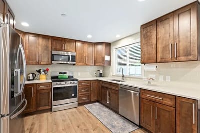 Modern kitchen interior with wooden cabinets and appliances