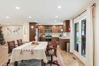 Bright kitchen and dining area with wood furniture