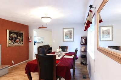 Dining area with a table set and artwork