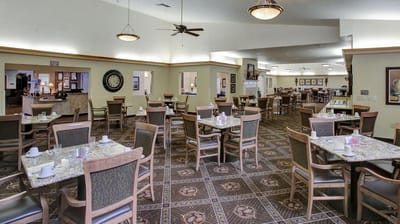 Bright dining room with tables set for meals