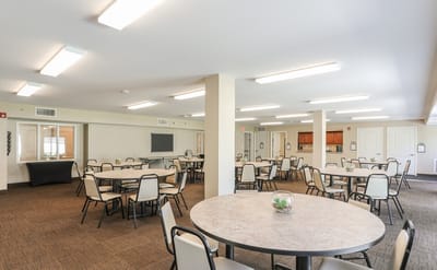 Interior view of a common dining area with tables