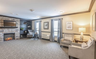 Cozy common area with comfortable seating and a fireplace