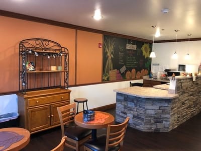 Cozy interior space with a serving counter and seating