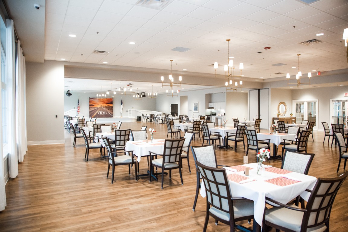 Dining room with tables set for residents