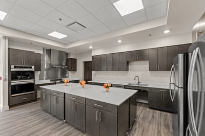 Modern kitchen with a large island and flowers