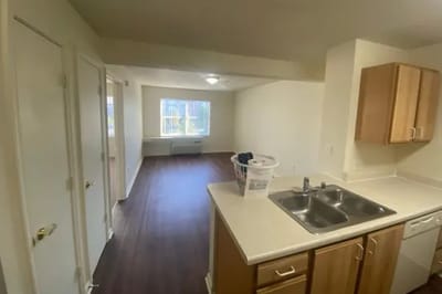 Interior view of a senior apartment kitchen and living area