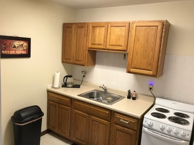 Bright kitchen area with wooden cabinets