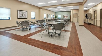 Bright and spacious dining area with tables and chairs