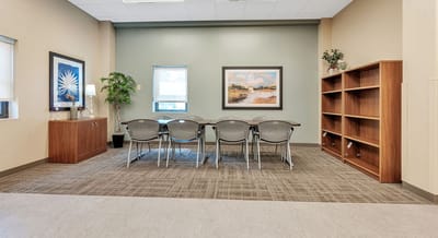 Bright common area with table and chairs