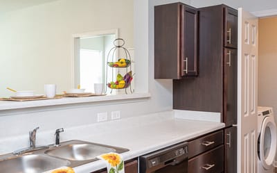 Bright kitchen area with fresh fruit display