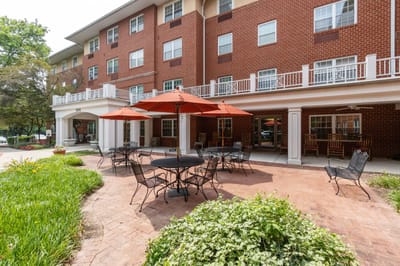 Outdoor patio area with tables and umbrellas
