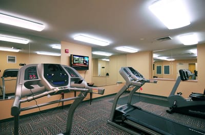 Interior view of a fitness room with treadmills
