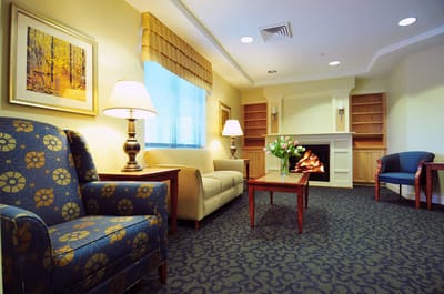 Cozy common area with seating and a fireplace