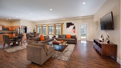 Bright interior common area with seating and artwork