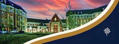 Exterior view of a senior living facility at sunset