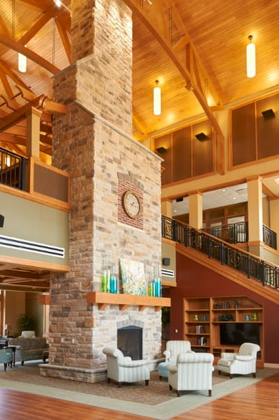 Spacious lobby with a stone fireplace
