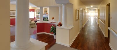 Bright hallway leading to common areas with seating