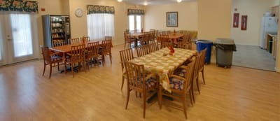 Dining area with tables and chairs in the common space