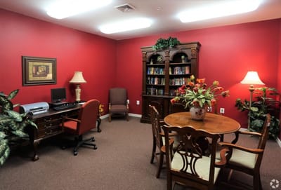 Bright activity room with furniture and bookshelves