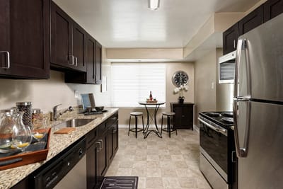 Modern kitchen interior of a resident unit with dining area