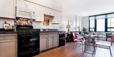 Modern kitchen and dining area in a resident unit