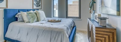 Brightly decorated resident bedroom with modern furnishings