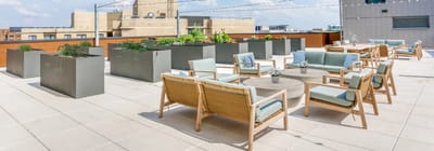 Rooftop outdoor space with seating and planters