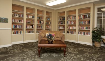 Cozy library corner with bookshelves and seating
