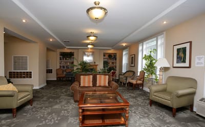 Interior view of a common area with seating and plants