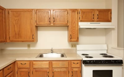 Bright kitchen area with wooden cabinets