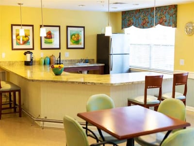 Bright dining area with colorful decor and kitchenette