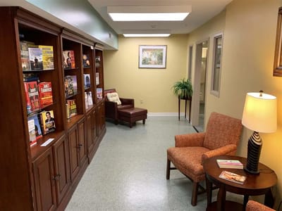 Interior common area with bookshelves and seating