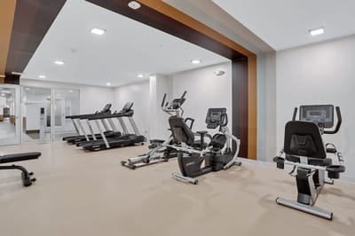 Fitness center with exercise equipment in modern interior