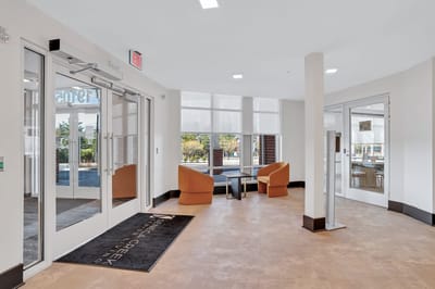 Interior lobby of a senior living facility with seating