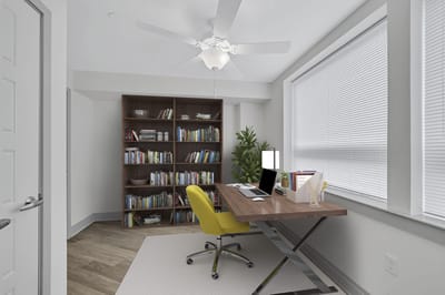 Bright, modern office space with a desk and bookshelves