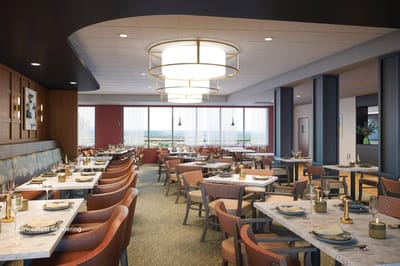 Dining area with modern furnishings and large windows