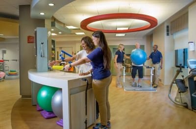 Residents participating in physical therapy exercises