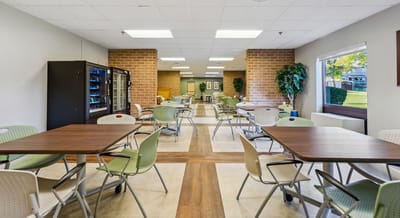 Bright dining area with tables and chairs in a common space