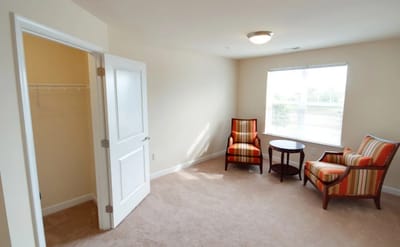 Interior view of a resident room with seating
