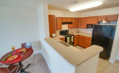 Modern kitchen area with dining table set