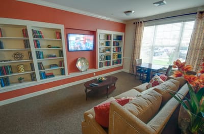 Cozy common area with seating and bookshelves