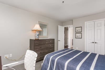 Cozy resident room with a bed and dresser