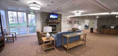 Cozy common area with seating and a fireplace