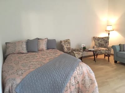 Cozy resident room with a bed and seating area