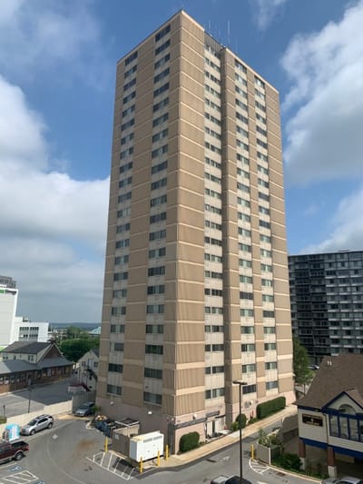 Exterior view of a tall assisted living facility building