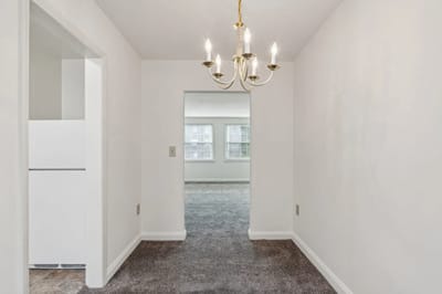 Bright interior hallway with chandelier lighting