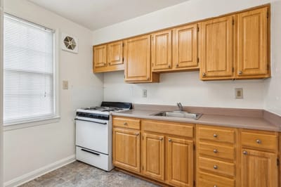 Interior view of a kitchen with wooden cabinets