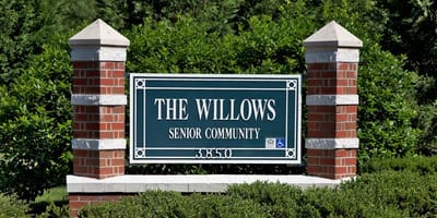 Exterior sign for The Willows Senior Community