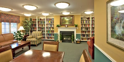 Cozy common area with bookshelves and seating
