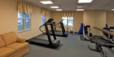 Well-equipped fitness room with exercise machines